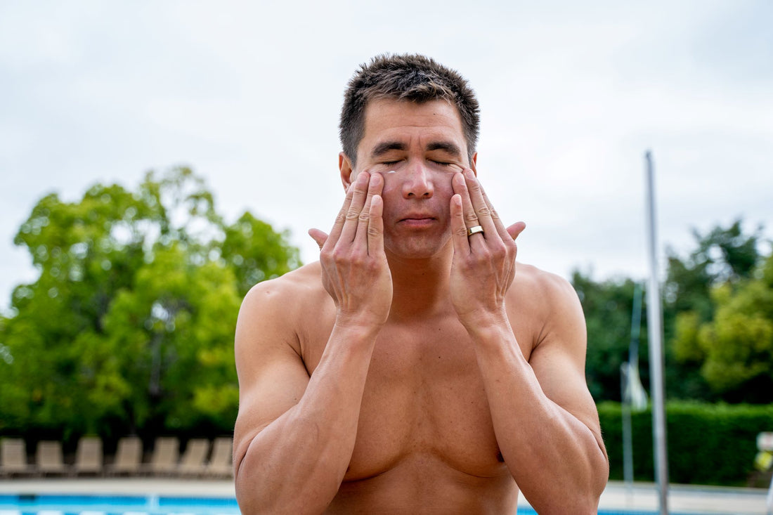 Nathan Adrian apply Dermasport's SPF 50 Facial Sunscreen before a swim. 