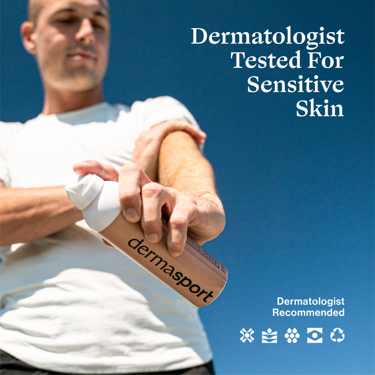 Person applying dermasport product to arm with blue sky background and text saying Dermatologist tested for sensitive skin